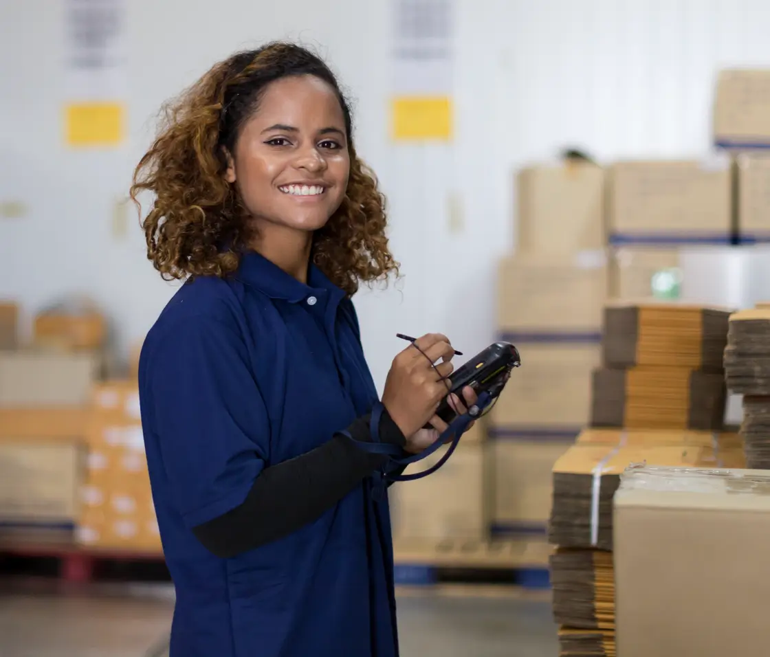 Woman in warehouse with tablet