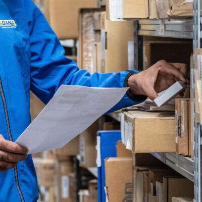 Close up of hands working in warehouse