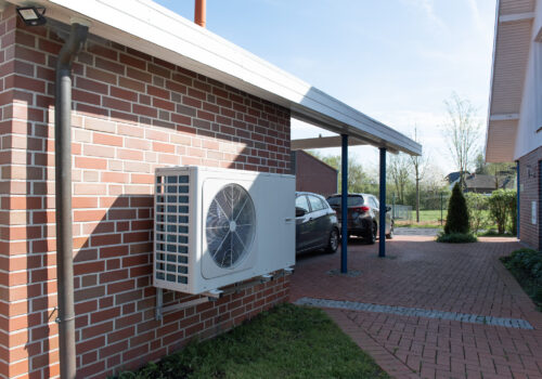 Air Source heat pump fitted outside a new home development