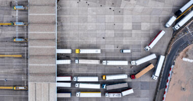 Trucks Queuing At A Depot