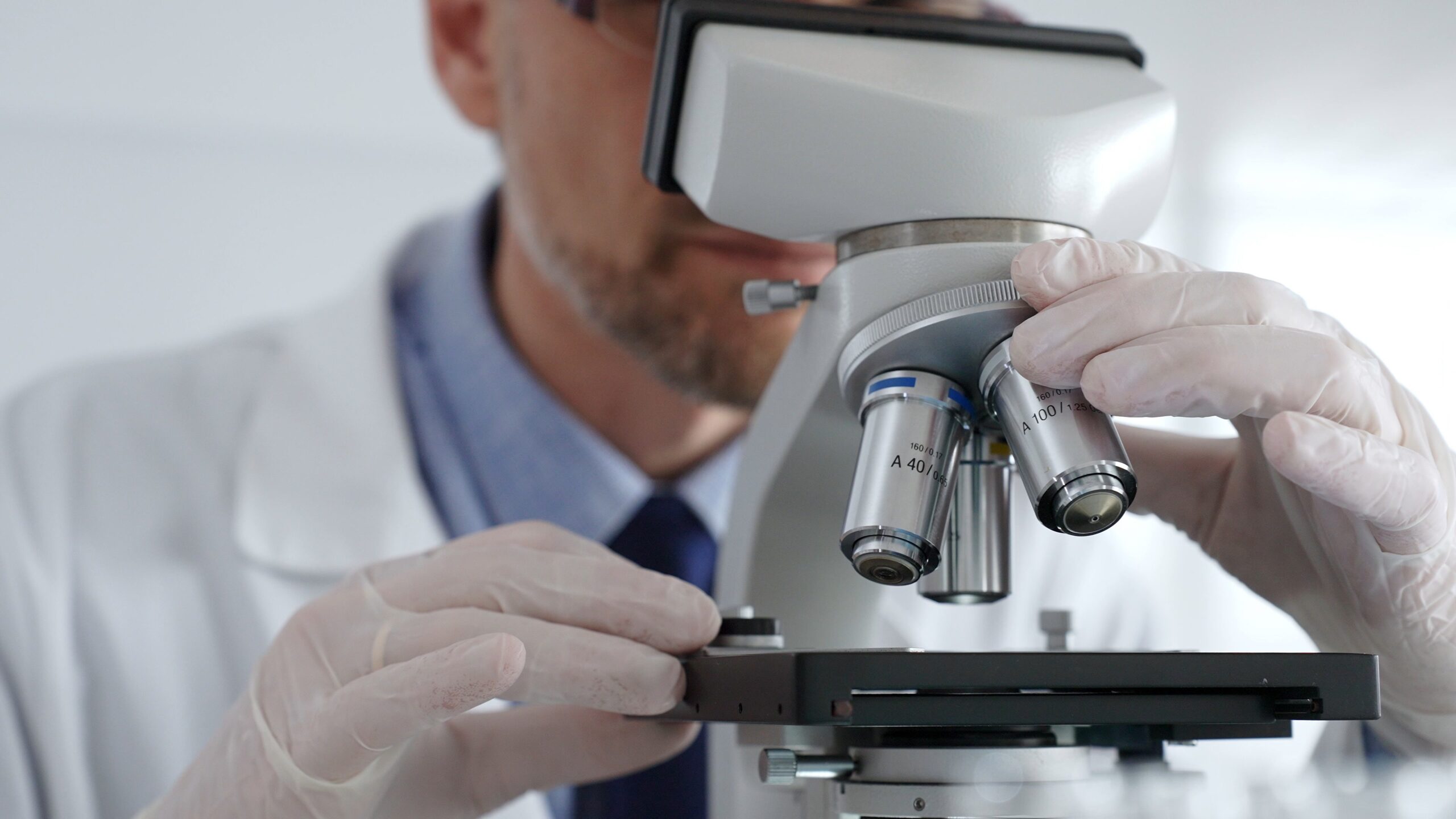 A scientist using medical equipment in a lab